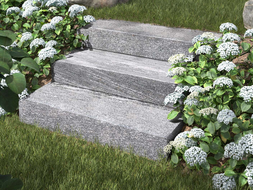 Gradini a blocco di Gneiss Urban Grey Line con fiori e prato