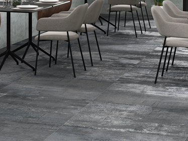 Zona pranzo con Piastrelle Iron Graphite effetto cemento