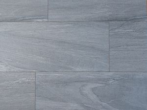 Piastrelle effetto pietra in grigio e bianco fotografate dall'alto