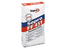 Un sacchetto di adesivo flessibile grigio per la posa di Piastrelle